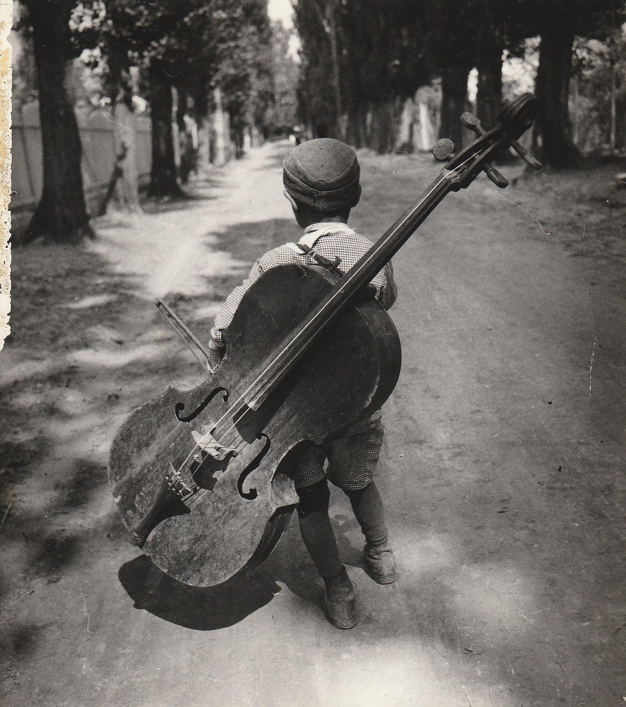 Gypsy boy with cello, Hungary 1931