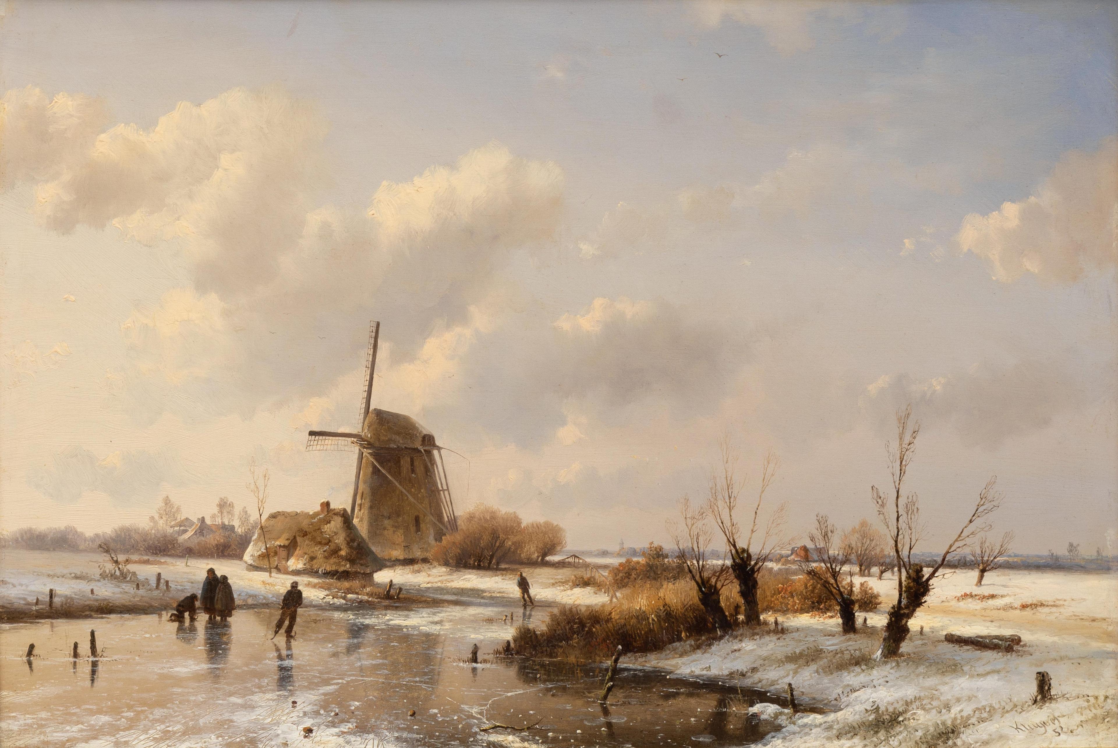 A Dutch winter landscape with a sleigh by the windmill